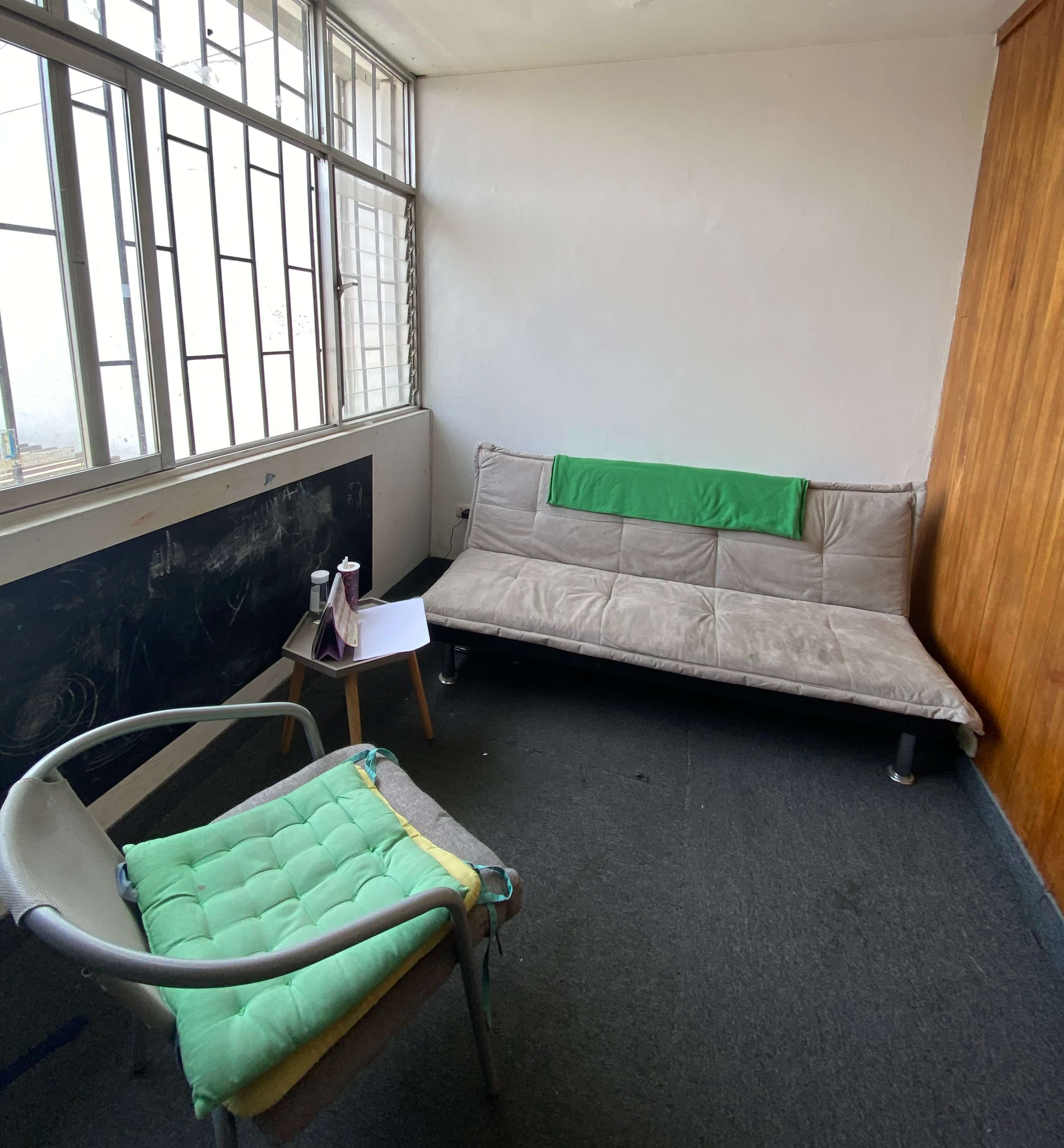 The therapy room with a sofa and seating